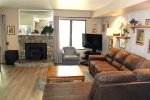 Mammoth Lakes Condo Rental Sunshine Village 175 - Open Living Room with Pellet Stove